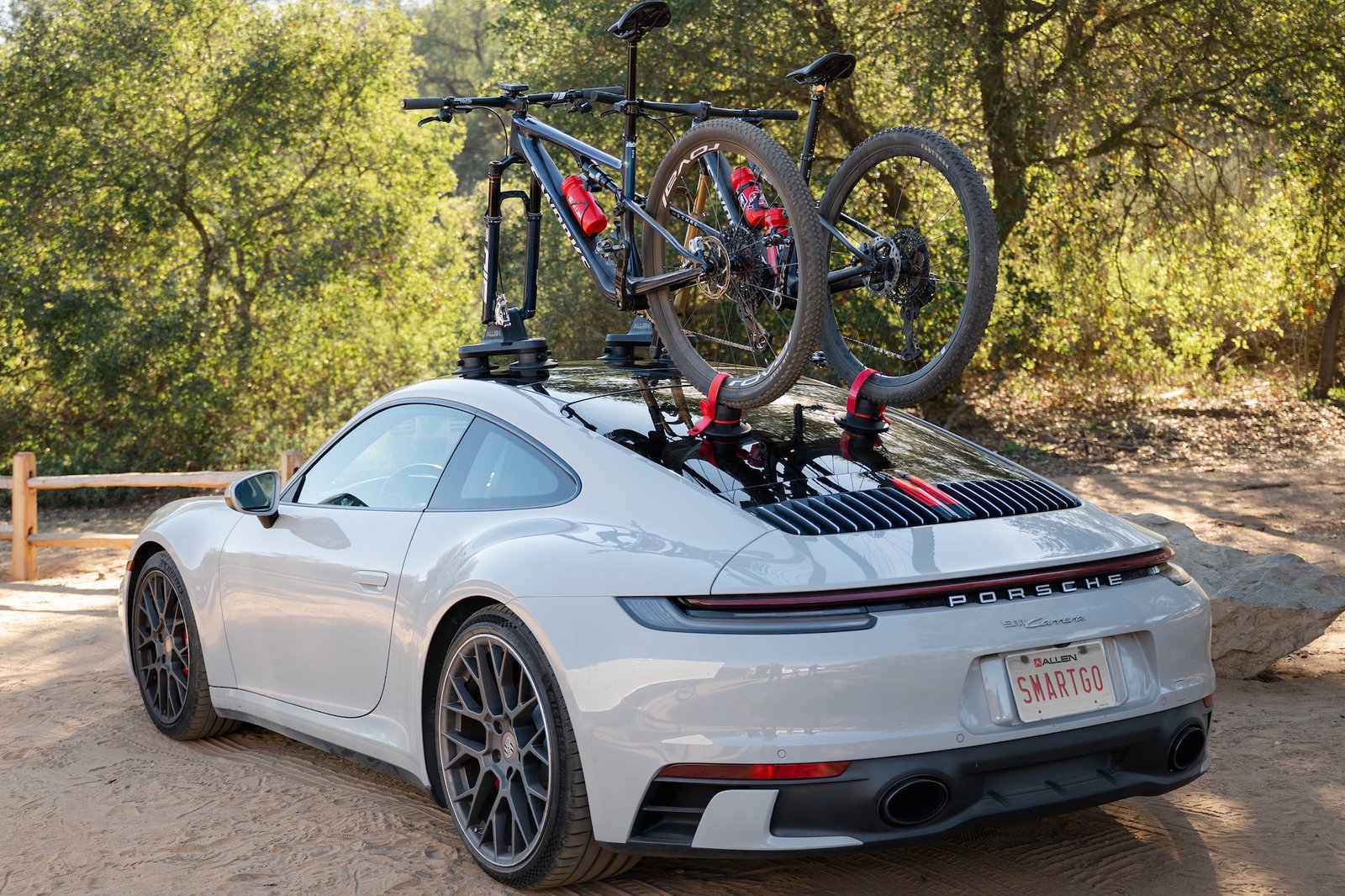 two specialized mountain bikes mounted on the Allen Smart Suction Go racks on a porsche.