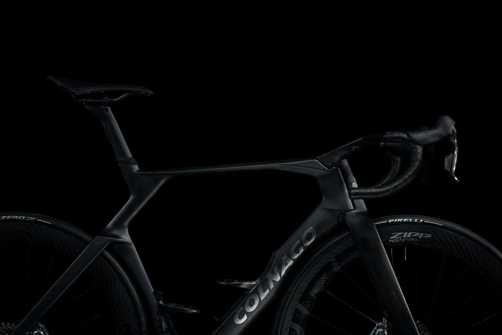 shadowy shots of a black Colnago bike on a black background