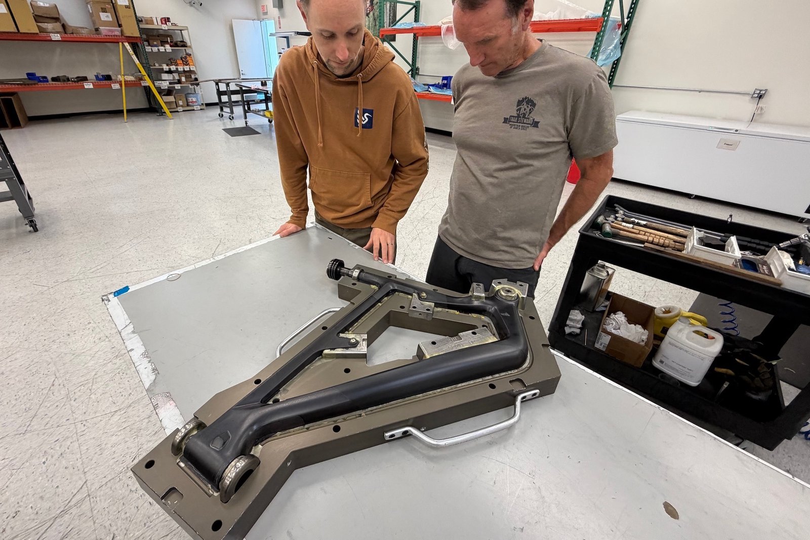 Colin Hughes and Scot Nicol checking out a fresh Ripley SL that's still half inside the mold.