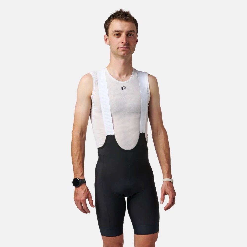studio image of a man wearing the Pearl Izumi Red Bibs