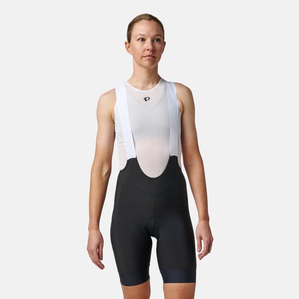 studio image of a woman wearing the Pearl Izumi Red Bibs