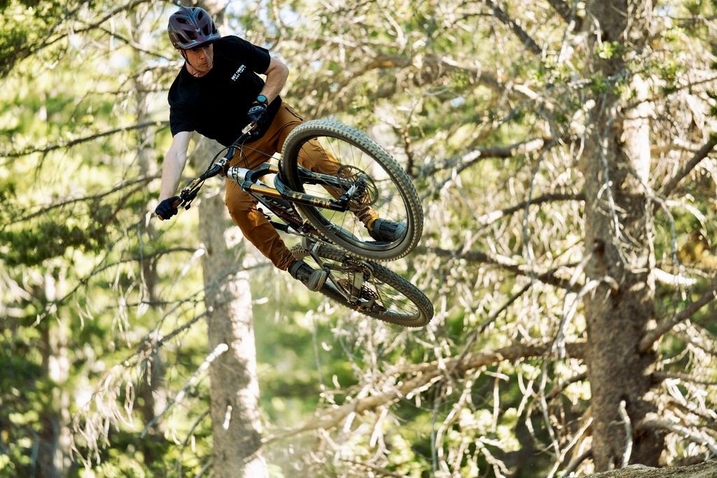Rick Reed hitting a jump at Sky Tavern on a mountain bike