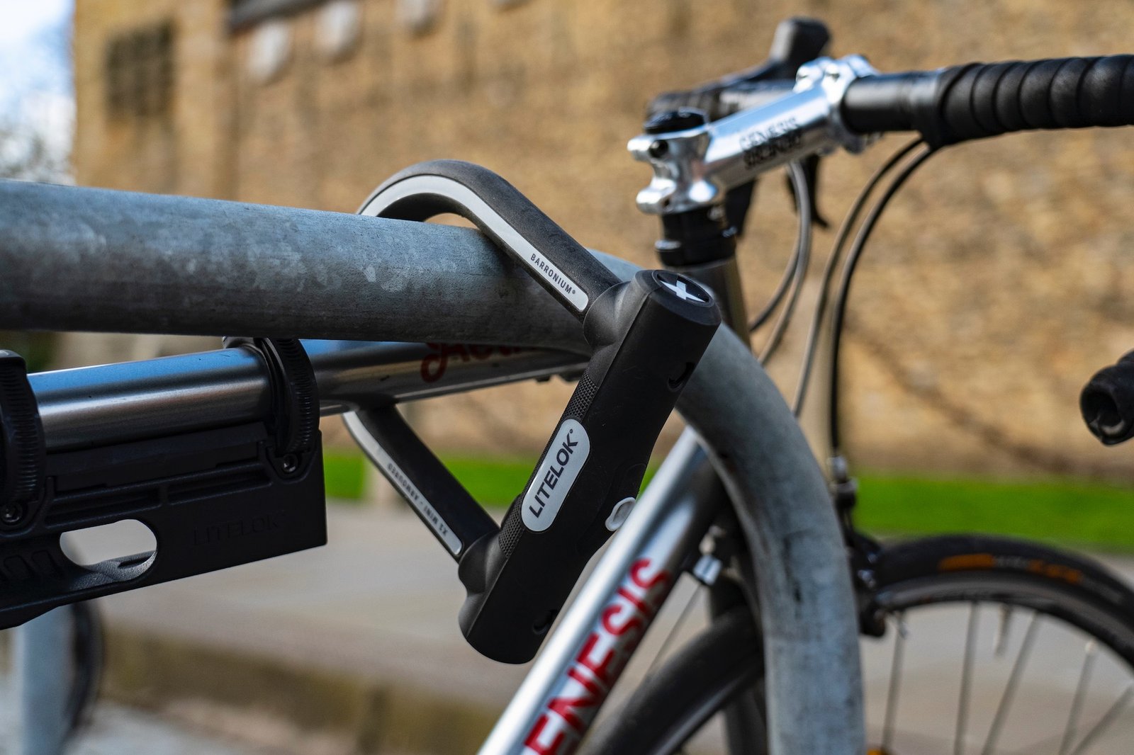 The Litelok X1 Mini Bike lock in use locking a bike frame to a bike rack