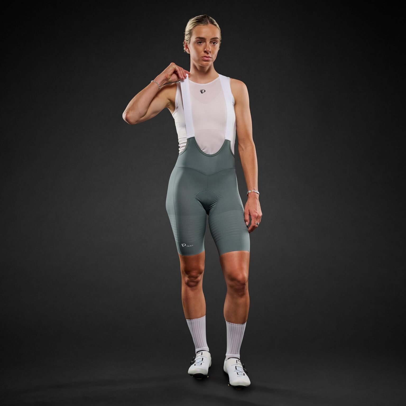 studio iamge of a woman wearing the new Pi Black bibs