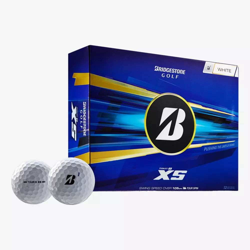 A box of Bridgestone Golf TOUR B XS, considered among the best golf balls 2026, with two balls in front. The blue packaging with yellow and white accents highlights the Bridgestone logo and product details.