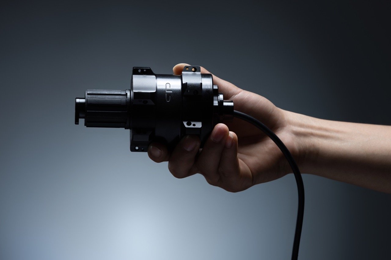 a person holding the CYPLORE hub in their hand