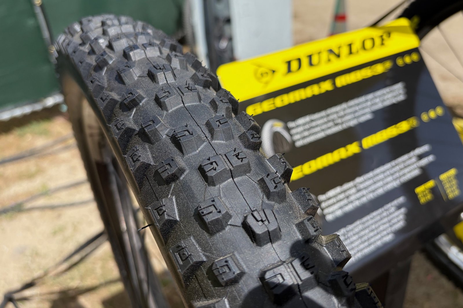 checking out the tread of the MB53F tire at the Dunlop booth at Sea Otter.
