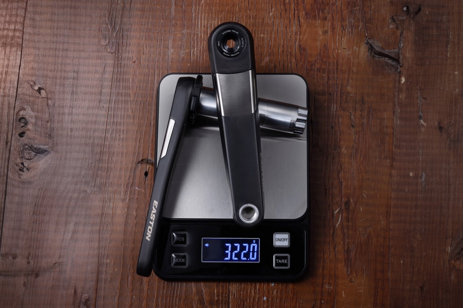 the Easton EC90 ALX cranks on a scale showing a weight of 322 grams