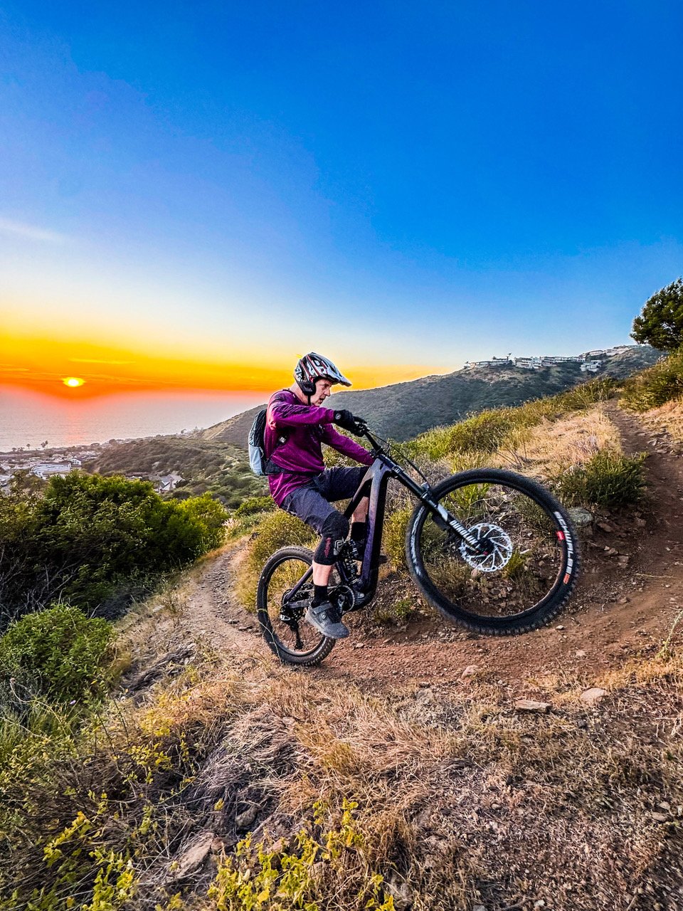 Hans wheelies through a turn with his Bosch-powered Santa Cruz