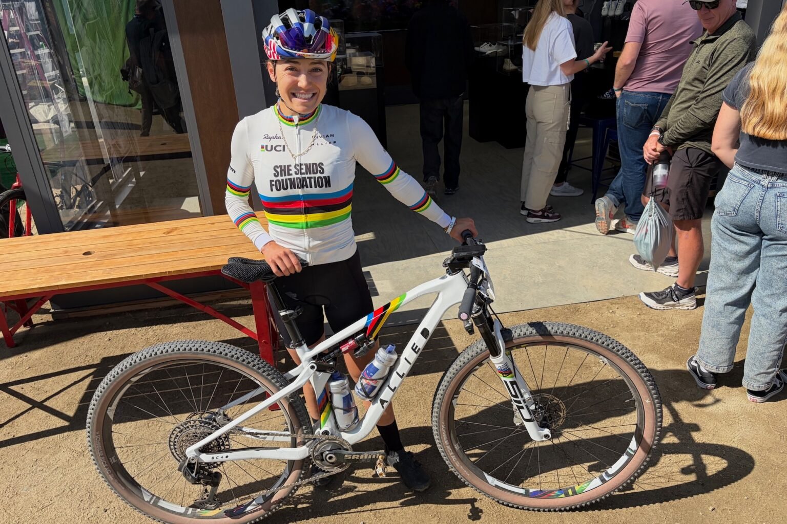 Kate Courtney posing with her custom painted Allied BC40 race bike