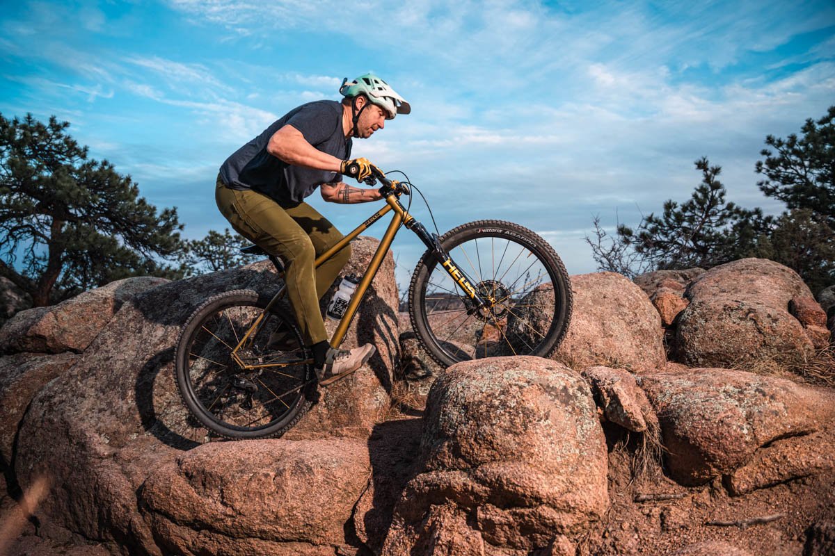 REEB Cycles Hall Pass, rider, rock climb