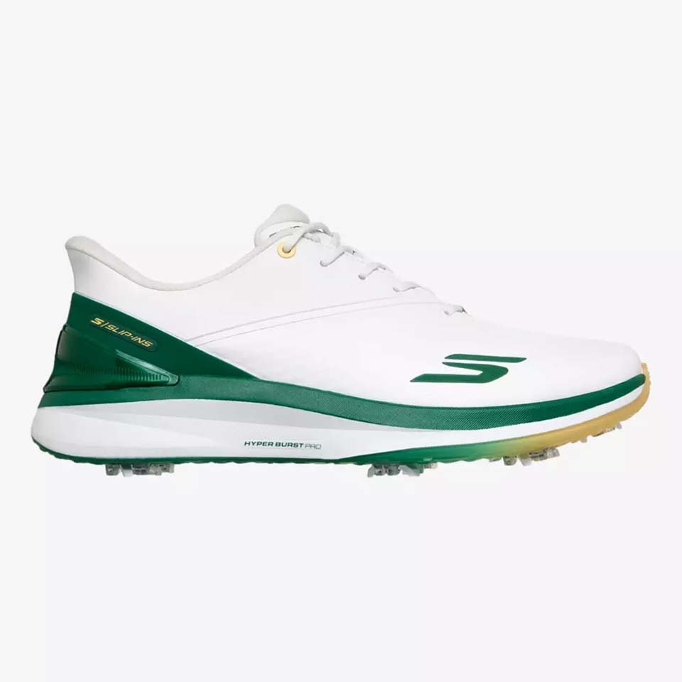 A white Skechers shoe with green accents and a green “S” logo on the side, inspired by RBC Heritage winner Matt Fitzpatrick. It features a low-profile design, spiked outsole, and is set against a plain, light background.