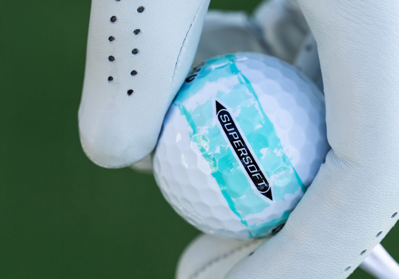 Callaway Supersoft Distressed golf ball in teal colorway.