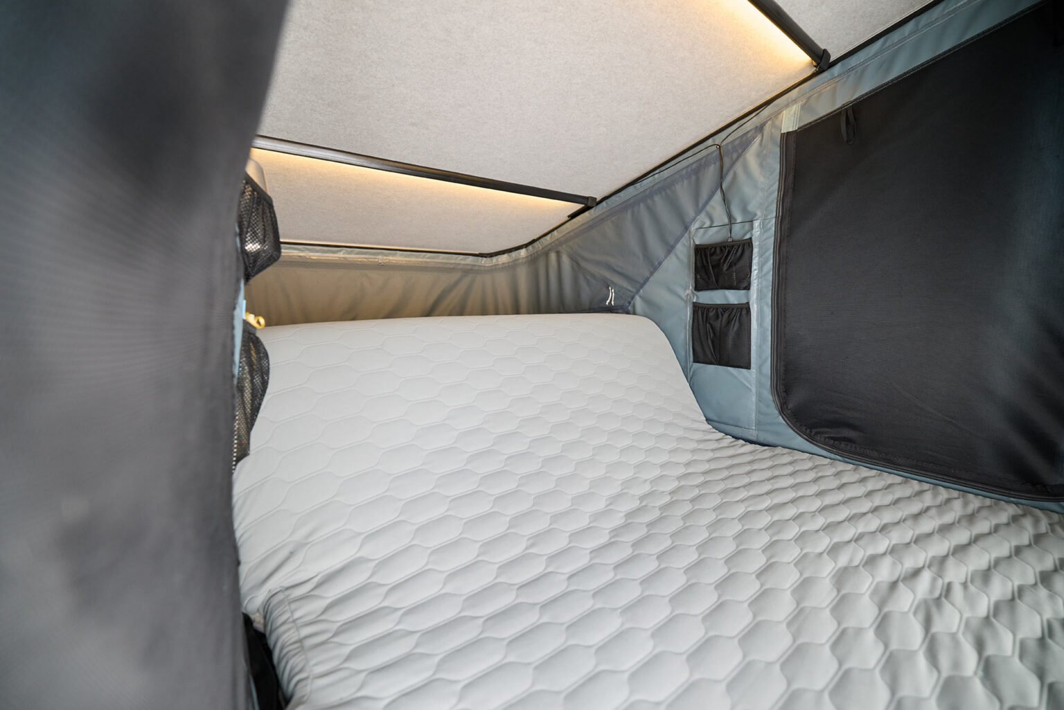 sofa mattress inside the thule widesky rooftop tent.
