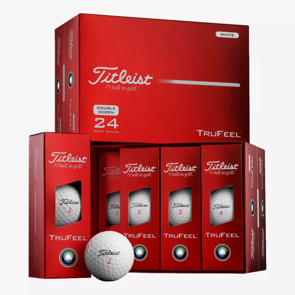 A display of red Titleist TruFeel golf ball boxes, including a large Double Dozen box and four smaller individual boxes, with a white Titleist ball in front—perfect for those seeking the best deals under $50.
