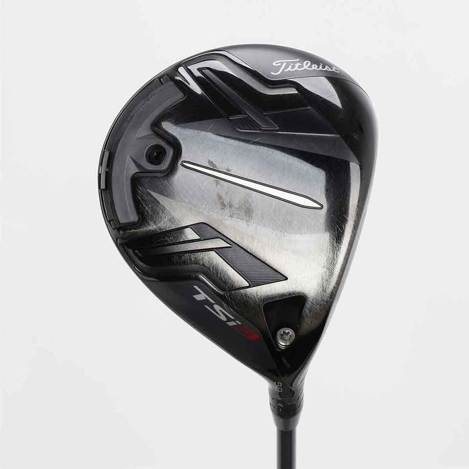 A close-up of a Titleist TSi3 golf driver head, showcasing its black and silver design, branding, and aerodynamic details—trusted by top 10 players on tour—on a plain white background.